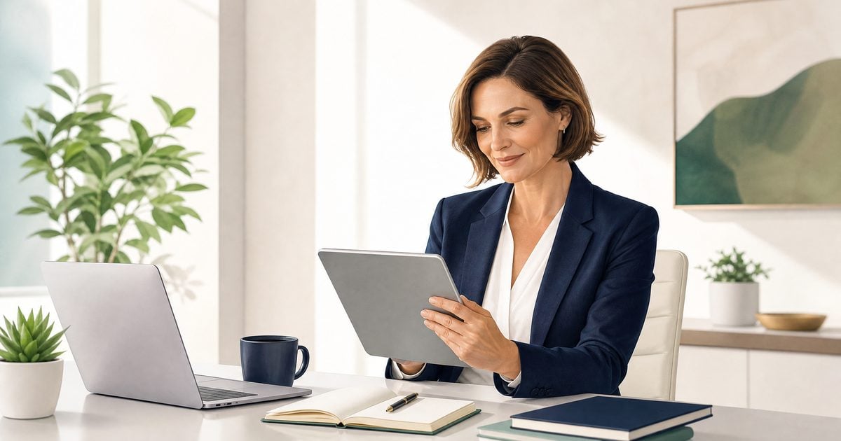 Non-technical business leader reading a digital AI workflows playbook in a bright office