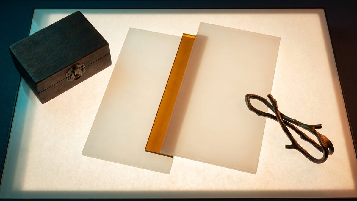 Two blank translucent layers reveal a narrow amber change beside a closed human decision box.