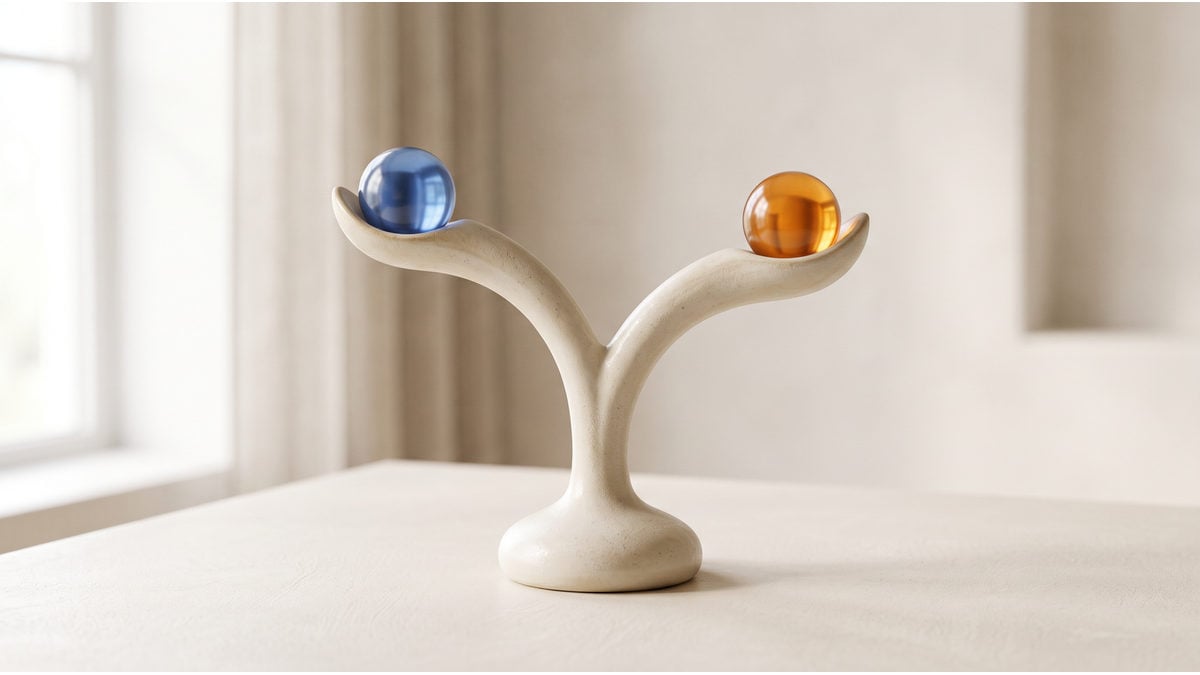A ceramic stem divides into branches supporting blue and amber spheres.
