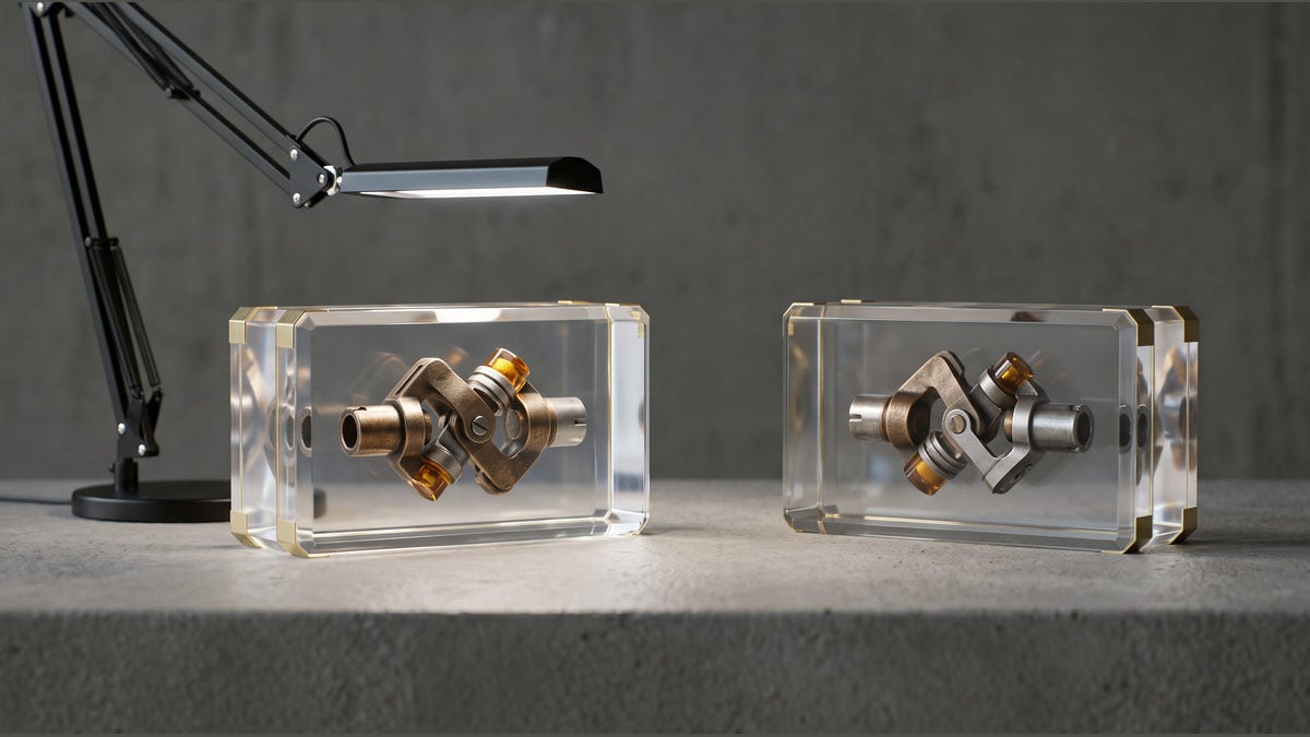 Two transparent boxes hold matching metal connectors beneath an inspection lamp.
